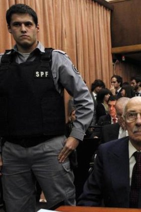 Former Argentine dictator Jorge Videla listens to the verdict during his trial in a courthouse in Buenos Aires.