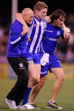 North's Jack Ziebell is helped off the ground.
