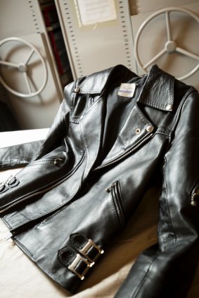 A leather jacket studded with silver buckles and zips that was worn by Bon Scott.