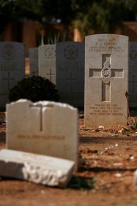 Damaged headstones of Commonwealth soldiers at the Benghazi War Cemetery in Libya.