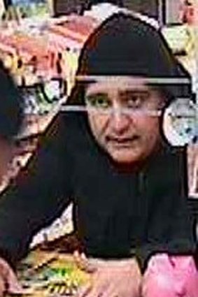 A man police wish to speak with in regards to a petrol station robbery in Preston.
