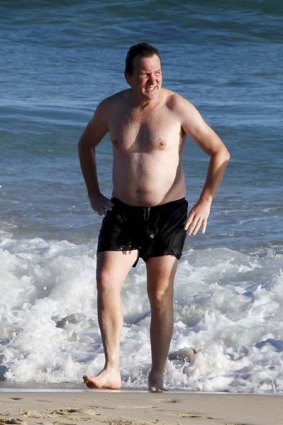 Riding the waves of controversy ... a seemingly carefree Mark McInnes at Bondi Beach last week.