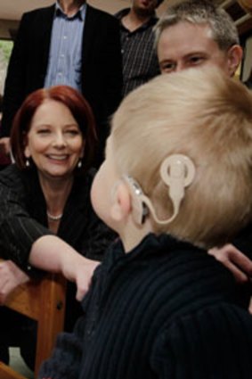 The Prime Minister, Julia Gillard, jokes with Ben Baulch when she visited the Taralye Kindergarten for Deaf Children in Blackburn, Melbourne, yesterday.