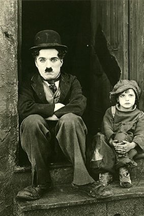 Charlie Chaplin and Jackie Coogan in <i>The Kid</i>.