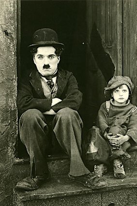 Charlie Chaplin and Jackie Coogan in <i>The Kid</i>.