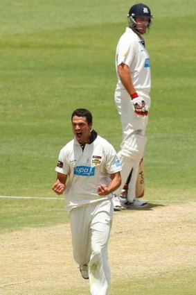 Nathan Coulter-Nile celebrates the wicket of Clint McKay.