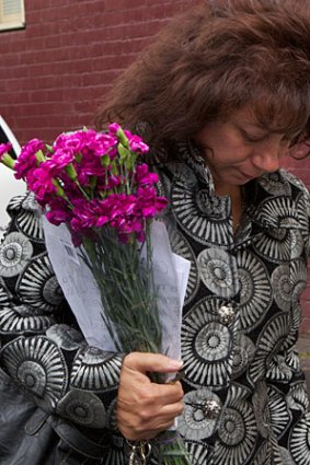 Chopper Read's wife Margaret leaves the memorial service.