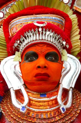 Trance party ... a dancer performs a theyyam, a sacred Hindu ritual.