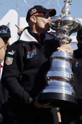 Sweet success: Oracle Team USA skipper Jimmy Spithill kisses the Auld Mug.