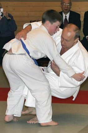 Russian President Vladimir Putin taken down by a student at a judo master class in St Petersburg.