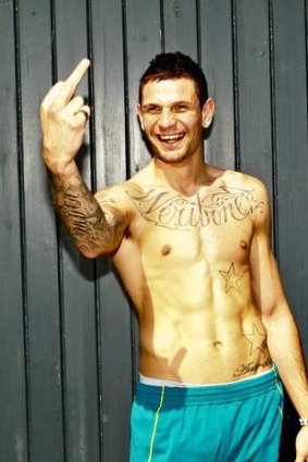 Australian boxer Damien Hooper gives a mate of the bird during the team fitting session in London. Photo Brendan Esposito