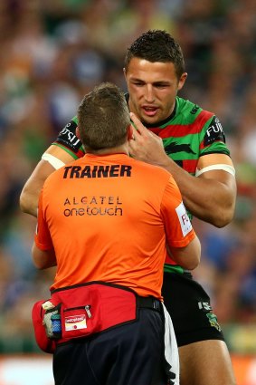 Sam Burgess is attended to during the grand final.