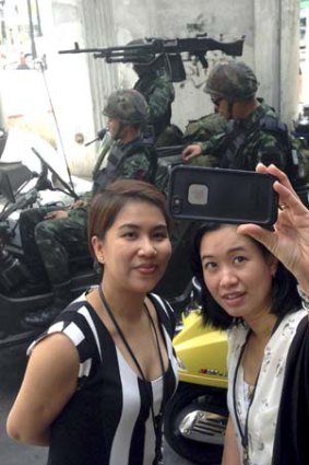 A selfie is taken at a military checkpoint in central Bangkok.