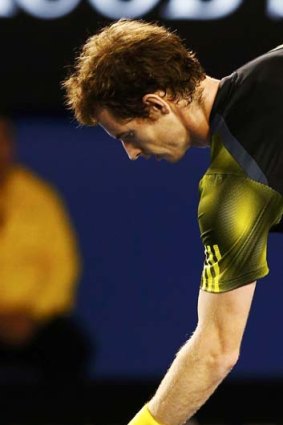 Stormy feather ... Andy Murray with the feather that interrupted his match.