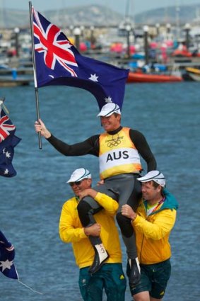 CHampions ... Australia's Tom Slingsby is carried from the water after his gold medal winning race.