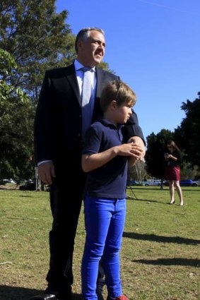 Joe Hockey with his son Xavier, 8, at a funding announcement in Concord, Sydney.