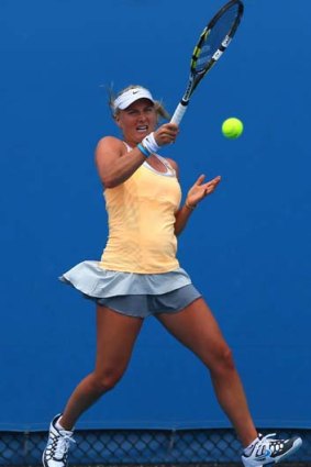 Sacha Jones plays a forehand in her first-round match against Kristyna Pliskova.