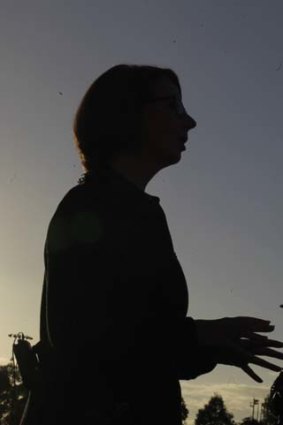 Twilight zone: Julia Gillard does a live TV cross from Blacktown Olympic Park on Monday.