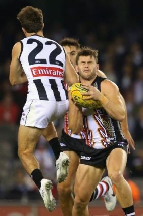 Steele Sidebottom hits Maverick Weller in the opening seconds of the Collingwood v St KIlda game last Friday night at Etihad Stadium.