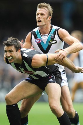 One more time: Dean Brogan (back) battles with Darren Jolly.