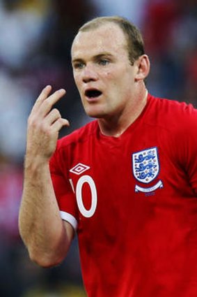 England's Wayne Rooney gestures to referee Jorge Larrionda following the incident.