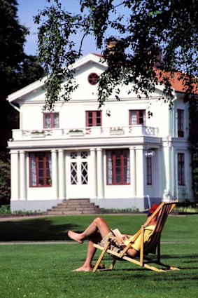 Salute to the sun ... relaxing in Tradgardsforeningen, the 19th-century park beside the canal.