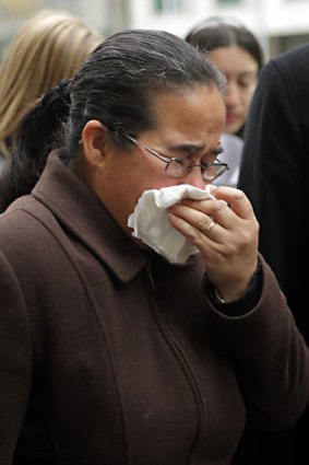 Idana Leveque, the mother of stabbing victim Marie Juliette Felicite, weeps outside court today.