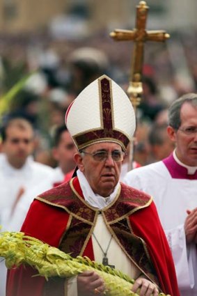 Celebrating Palm Sunday: Pope Francis walks to the altar after his blessing of the palms.