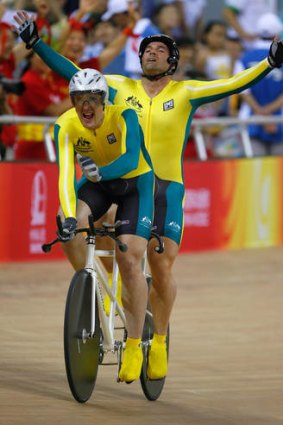 Gold rush: Kieran Modra raises his arms in triumph as he wins gold at the Beijing Paralympic Games.