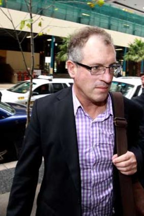 News Ltd journalist Steve Lewis leaves court.