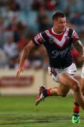 Switched on: Chris McQueen makes a break against the Roosters.