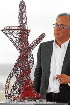 Anish Kapoor with a scale model of his design.