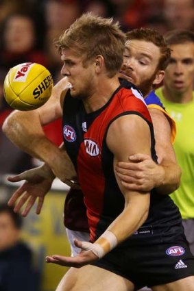 Daniel Merrett of the Lions tackles Michael Hurley of the Bombers on Saturday. Hurley was taken off after this incident.