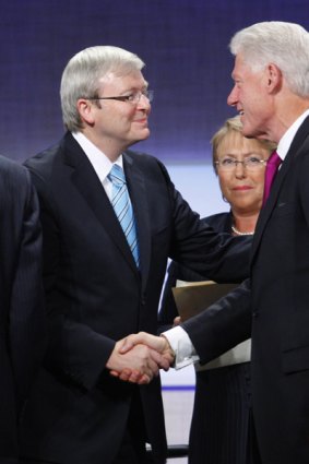 Former US President Bill Clinton (right) thanks Kevin Rudd (left), and Michelle Bachelet (centre), President of Chile, for their participation in a panel discussion at the Clinton Global Initiative in New York.