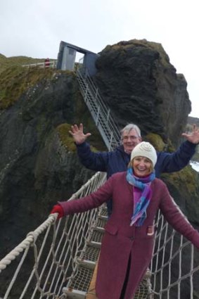 Guide Billy Scott and Louise Goldsbury's Irish-born mum on Carrick-a-Rede Rope Bridge.