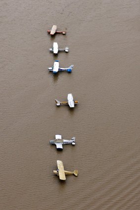 Planes sit at a flooded airport near the Addicks Reservoir as floodwaters from Harvey rise.