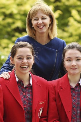 Mentone Girls' Grammar is taking a proactive approach to ensure the positive wellbeing of its students. Principal Fran Reddan with students.
