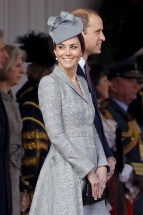 The Duchess wore a grey Alexander McQueen coat and matching coloured hat by Jane Taylor.