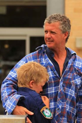 Shaken up &#8230; Scott Smiles and his son Riley, 11, survived a boating mishap with two others off North Head yesterday.