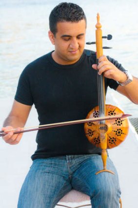 String theory... violinist Nawres Al-Freh plays the vertical fiddle known as a tarhu.