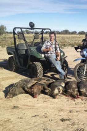 Hunters and gatherers … (from left) Matt Melhuish, Steve and Jarod Lee pose with the feral pigs killed after a shoot near Wilcannia, in far western NSW.