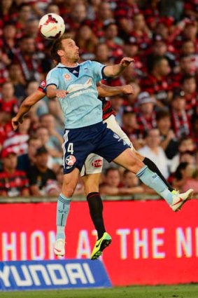 Heads up: Sydney's Ranko Despotovic and the Wanderers' Adam D'Apuzzo contest a high ball on Saturday night.