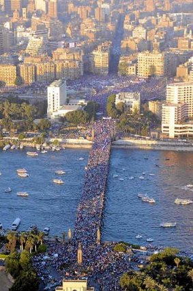 A handout picture released by the Egyptian army on July 27, 2013 shows an aerial view of a bridge leading to Cairo's Tahrir square (top) crowded with demonstrators on July 26, 2013.