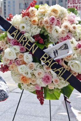 A floral tribute at Lauren Bacall's star on the Hollywood Walk of Fame.