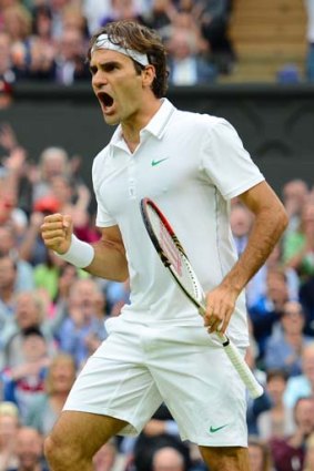 Roger Federer takes the third set from Novak Djokovic yesterday.