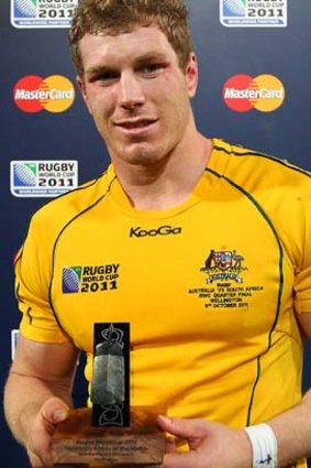 David Pocock poses with the man of the match award following the quarter-final victory over South Africa.