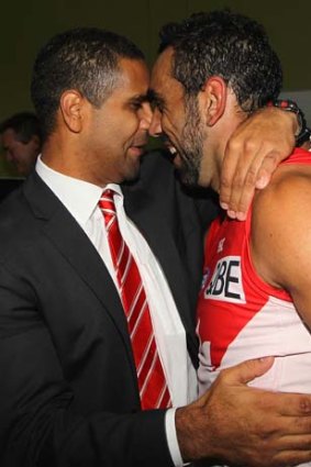 Time to celebrate ... Adam Goodes, right, with former Sydney games record holder MIchael O'Loughlin after the game.