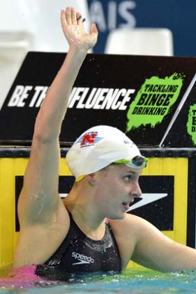 Belinda Hocking waves to the crowd after winning the final of the Womens 200 metre backstroke.