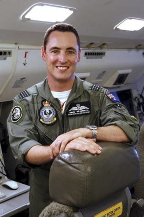 Squadron Leader Simon Wildermuth, inside the Airborne Early Warning and Control Wedgetail aircraft station.