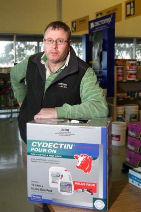 Cobden Landmark manager Anthony Lucas with cattle drench, which was stolen from the store.